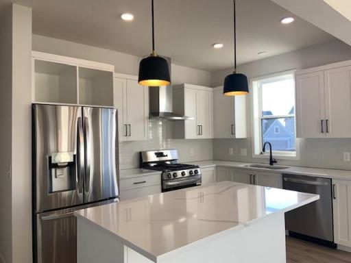 The stainless steel hood is not just beautiful but functional as well. This beauty vents to the exterior of the home which is an excellent choice for improving kitchen ventilation. Photos are from previously built home; options and features will vary