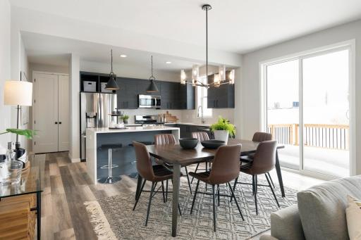 Photos are from previous, similar model. The options, features and color scheme will vary. Actual home has white shaker style kitchen cabinets.