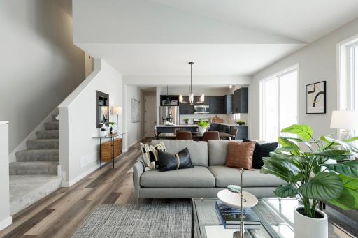 Photos are from previous, similar model. The options, features and color scheme will vary. Actual home has white shaker style kitchen cabinets. The open concept encourages interaction, so family members can easily talk to each other.