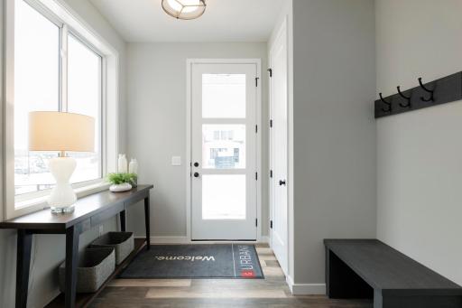 Photos are from previous, similar model. The options, features and color scheme will vary. A large and bright foyer is the perfect entry to a home that immediately conveys a sense of elegance, spaciousness, and openness.