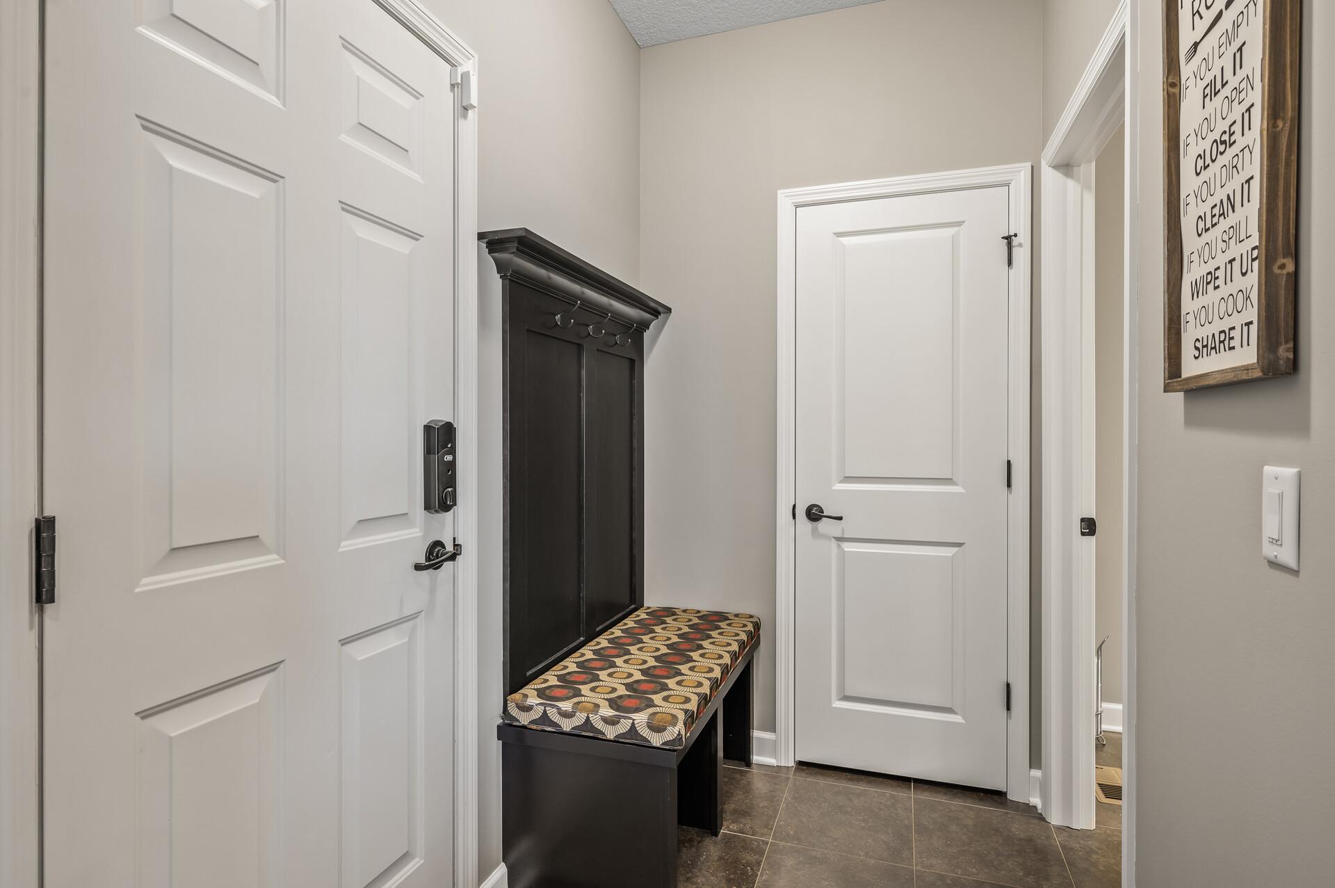 The entrance from the 3 car garage delivers a place for coats and shoes keeping you organized!