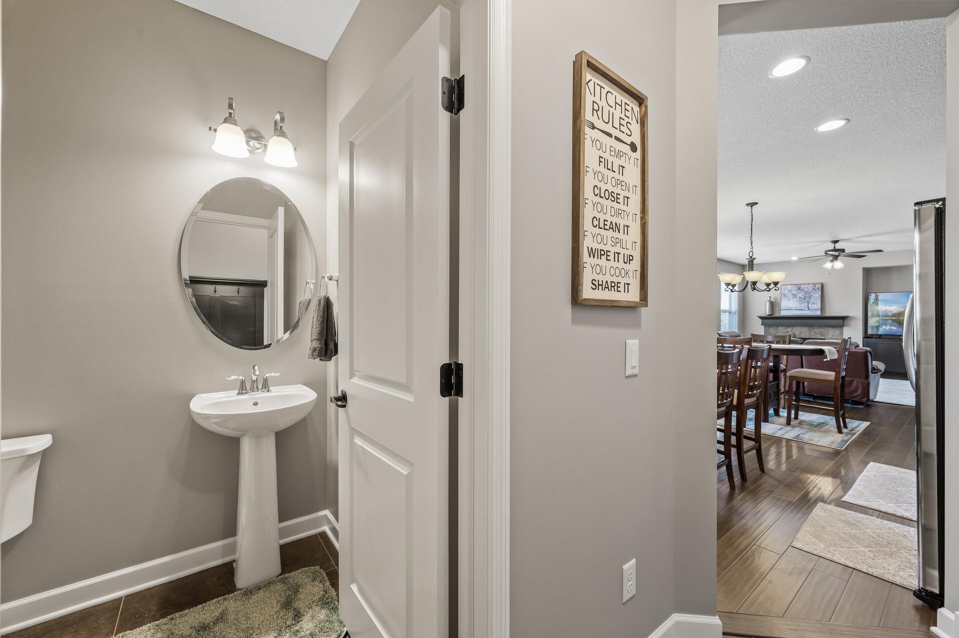 Main floor 1/2 bath is convenient to all living spaces making it ideal for guests and every day use.
