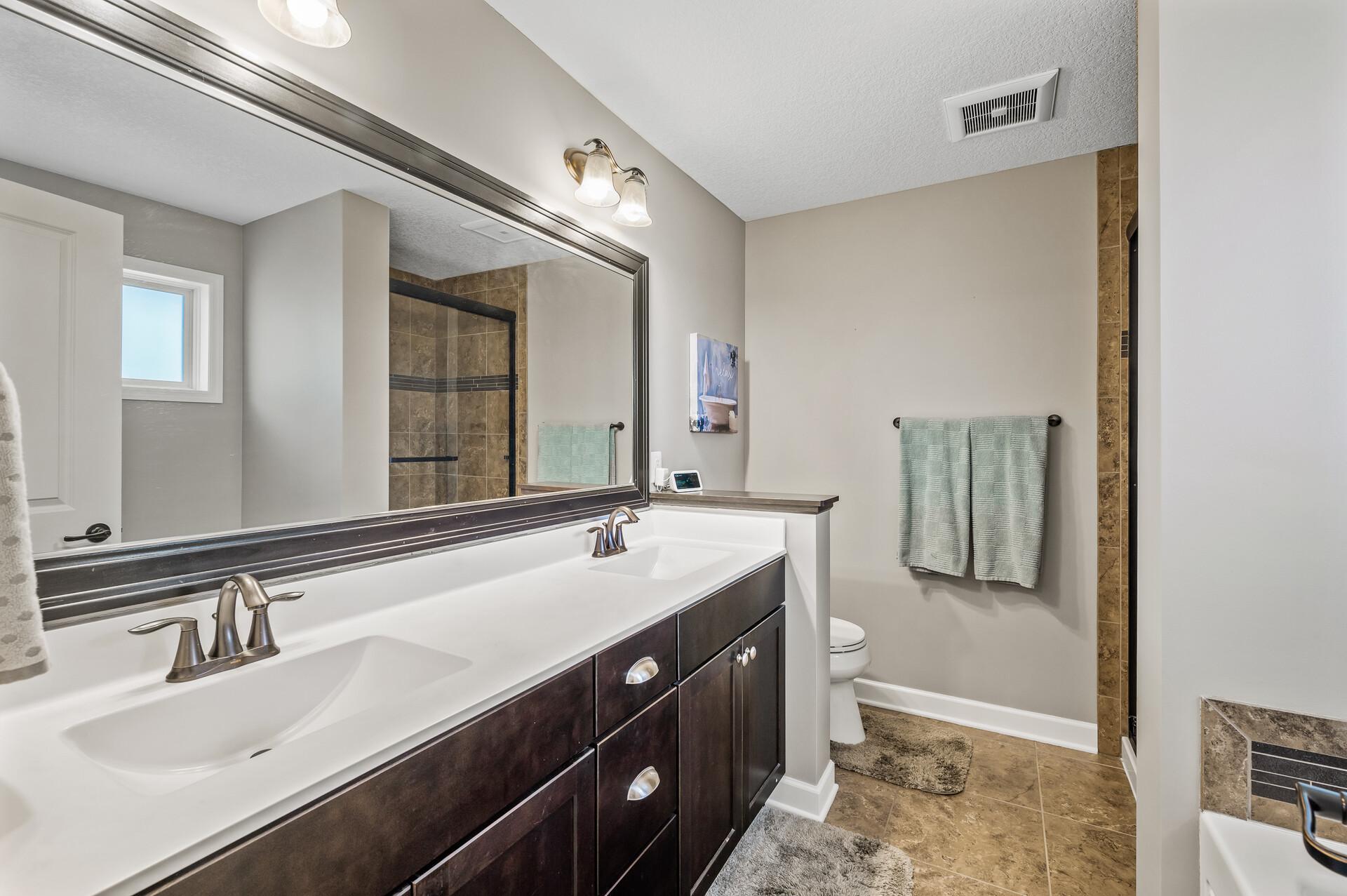 Another stunning space with a large spacious tub and separate walk-in shower.
