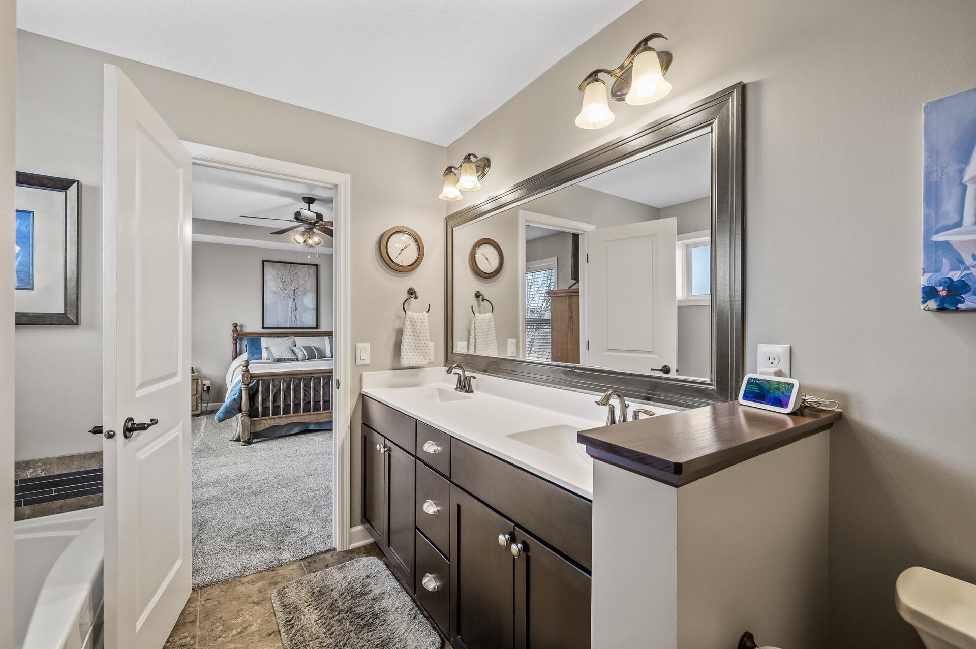 Double sinks, spacious vanity complete with plenty of counter space all add to the functionality of this ensuite.