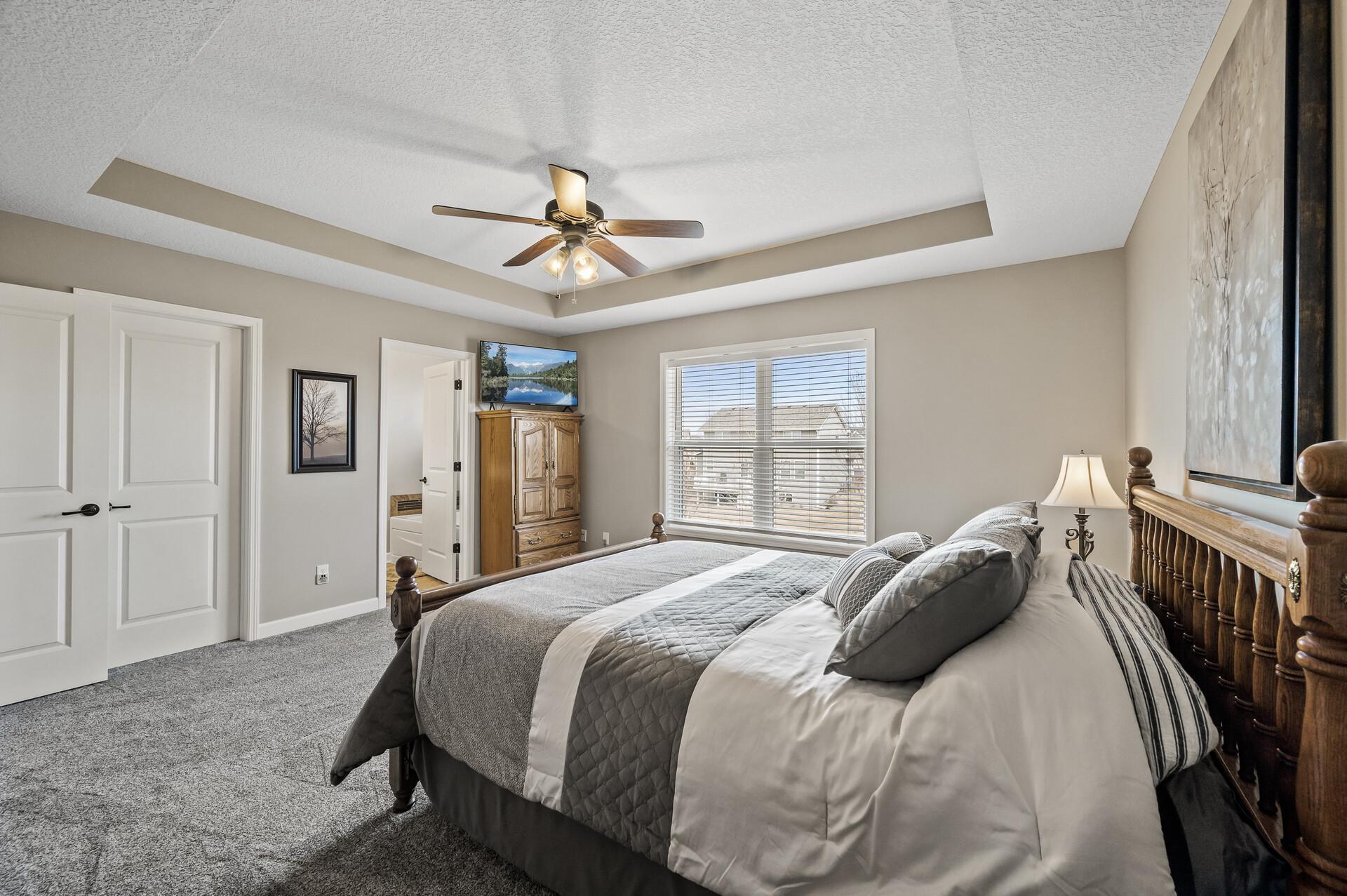 The primary bedroom also offers a walk-in closet and private ensuite.