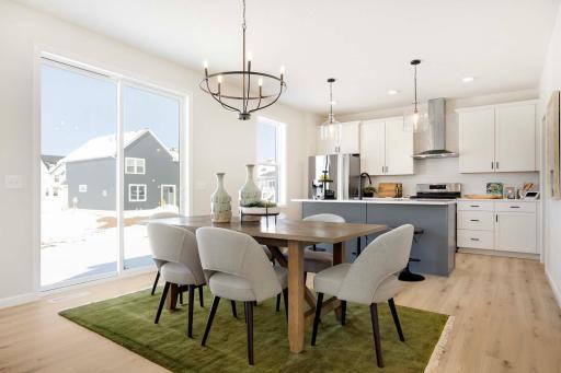 The well-appointed and organized kitchen is designed for both style and functionality. It features sleek, stainless steel appliances, including a modern LG gas range. Photos are from previously built home; options and features will vary.