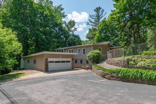 Turn key house surrounded by wooded privacy and outstanding views. The landscaping is outstanding. Big 20 x 32 garage with extra parking.