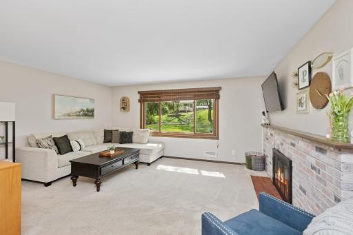 Large window in the Living room with views of the backyard
