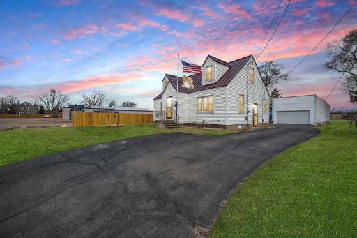 This Cape Cod-inspired cutie comes with a massive 6-car garage, sittin' pretty on a 0.78-acre playground!