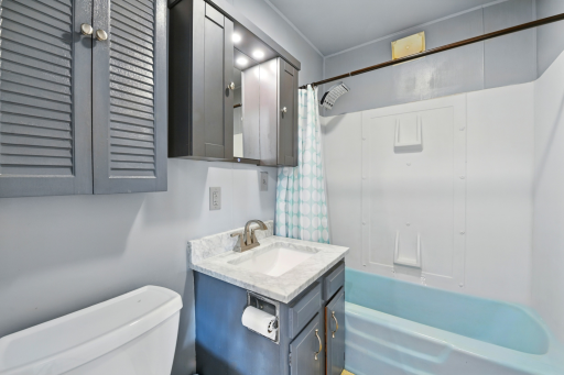 Two bathrooms on the main level? You betcha! This full guest bath is perfect for company or everyday convenience!