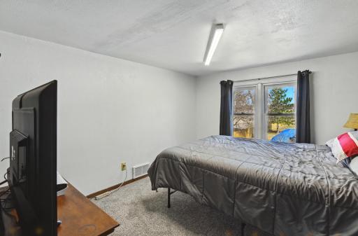 This upper-level bedroom is all spruced up with brand-new carpet in April 2025!