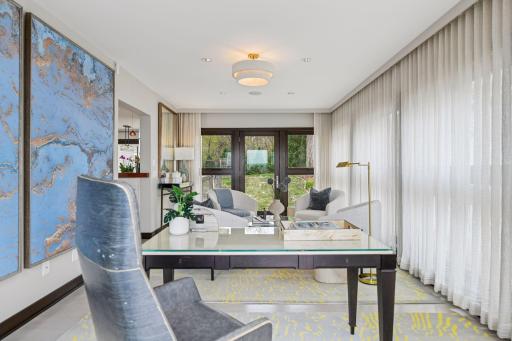 Main floor sitting room/office with access to courtyard