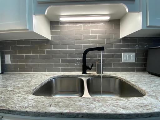 Beautiful granite countertops and new modern faucet!