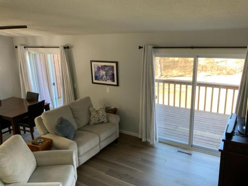 2 slider doors open to the oversized deck.