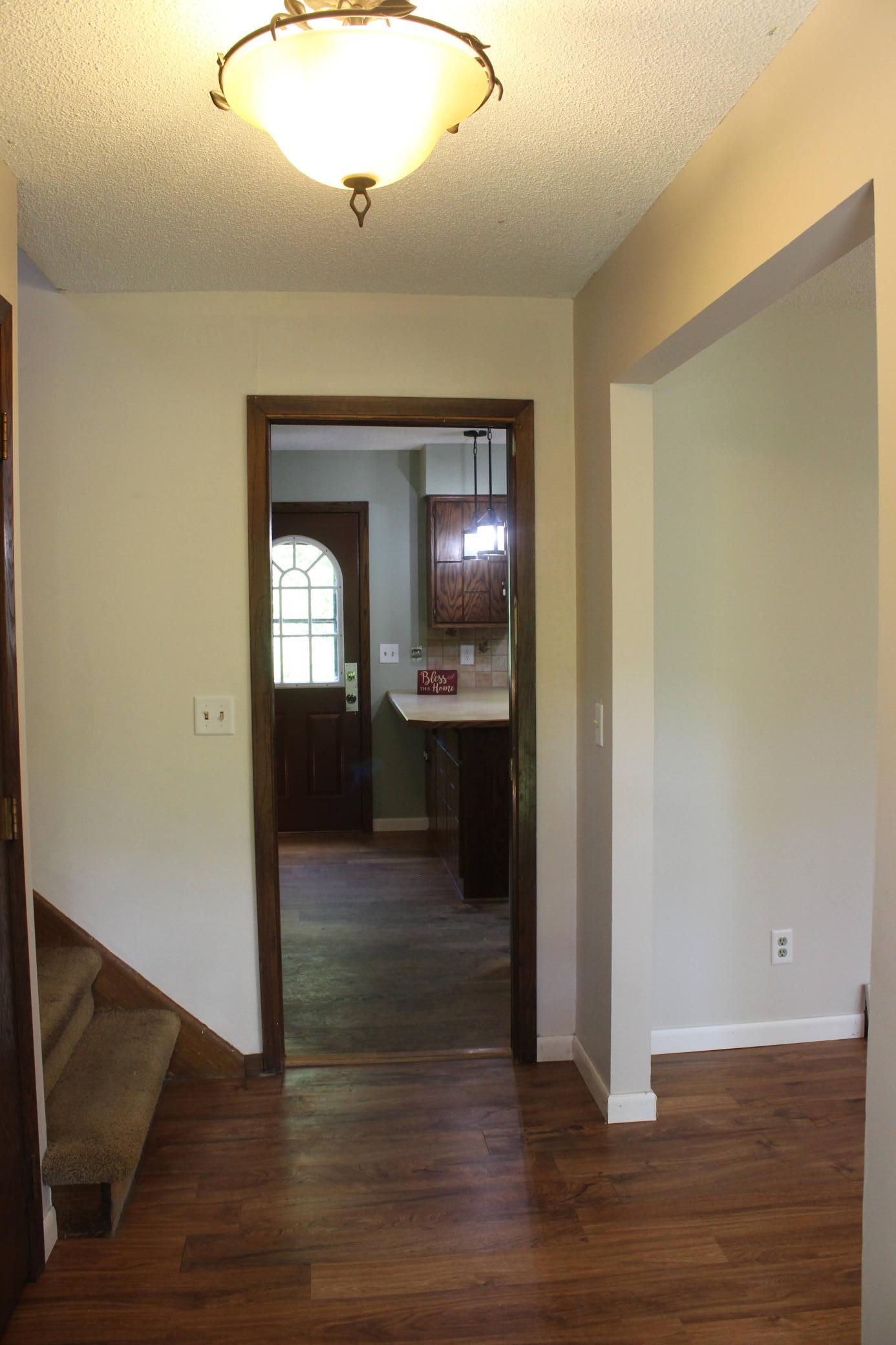 Entryway with Living Room to the right, Kitchen straight ahead and all 3 Bedrooms upstairs.