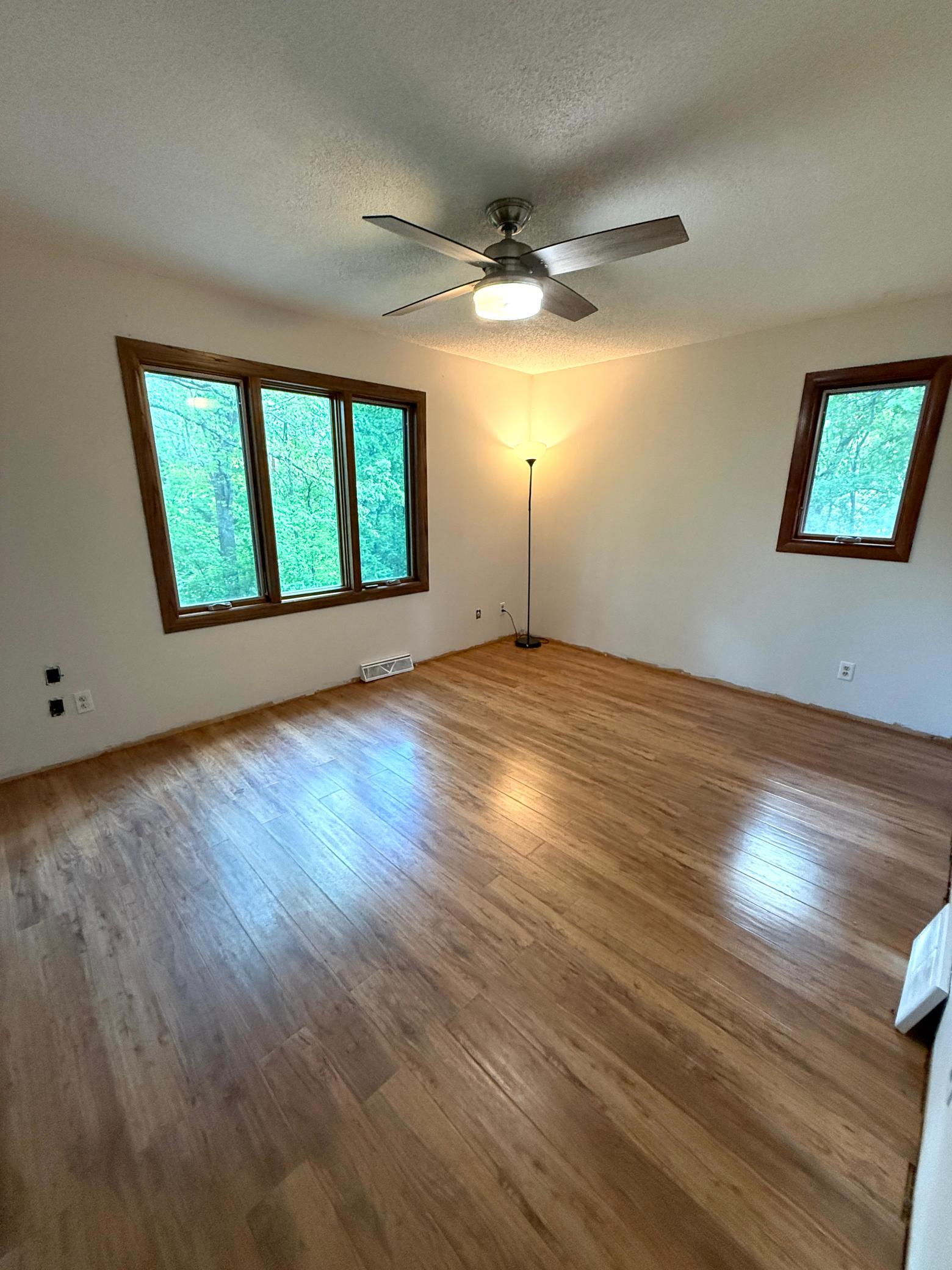 Large Primary Bedroom with the bathroom entrance.