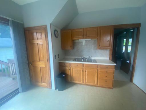 Kitchen (Door leads out the side door and to the basement)