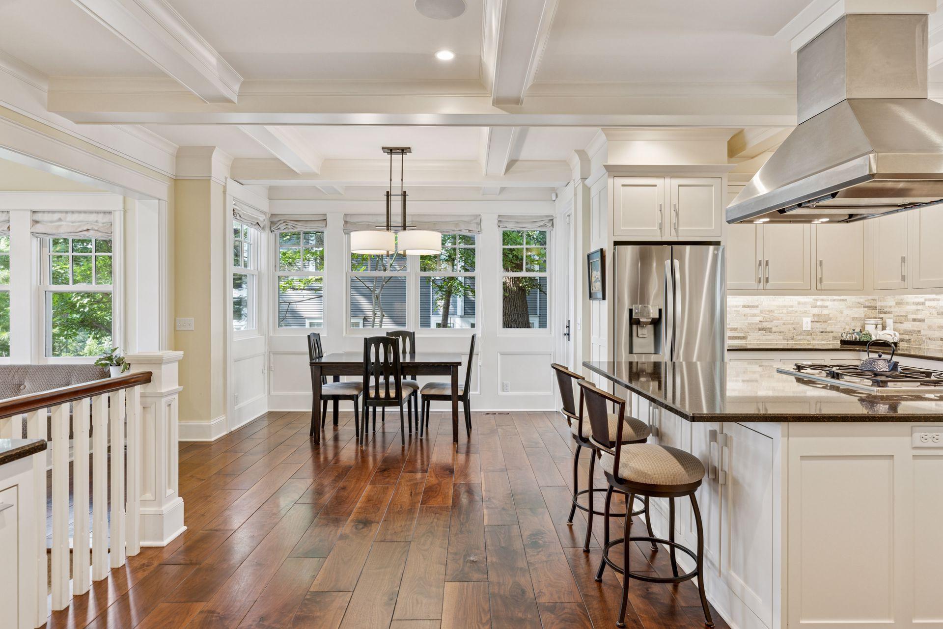 33x24 Fully Renovated Main Level Kitchen with new east, west and north-facing Marvin Ultimate wood windows, 8-inch solid walnut floors, custom enameled Danners cabinetry, coffered ceilings and mill work, Granite countertops and stainless appliances.
