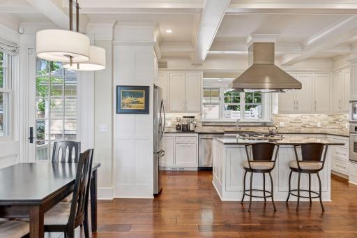 33x24 Fully Renovated Main Level Kitchen with new east, west and north-facing Marvin Ultimate wood windows, 8-inch solid walnut floors, custom enameled Danners cabinetry, coffered ceilings and mill work, Granite countertops and stainless appliances.