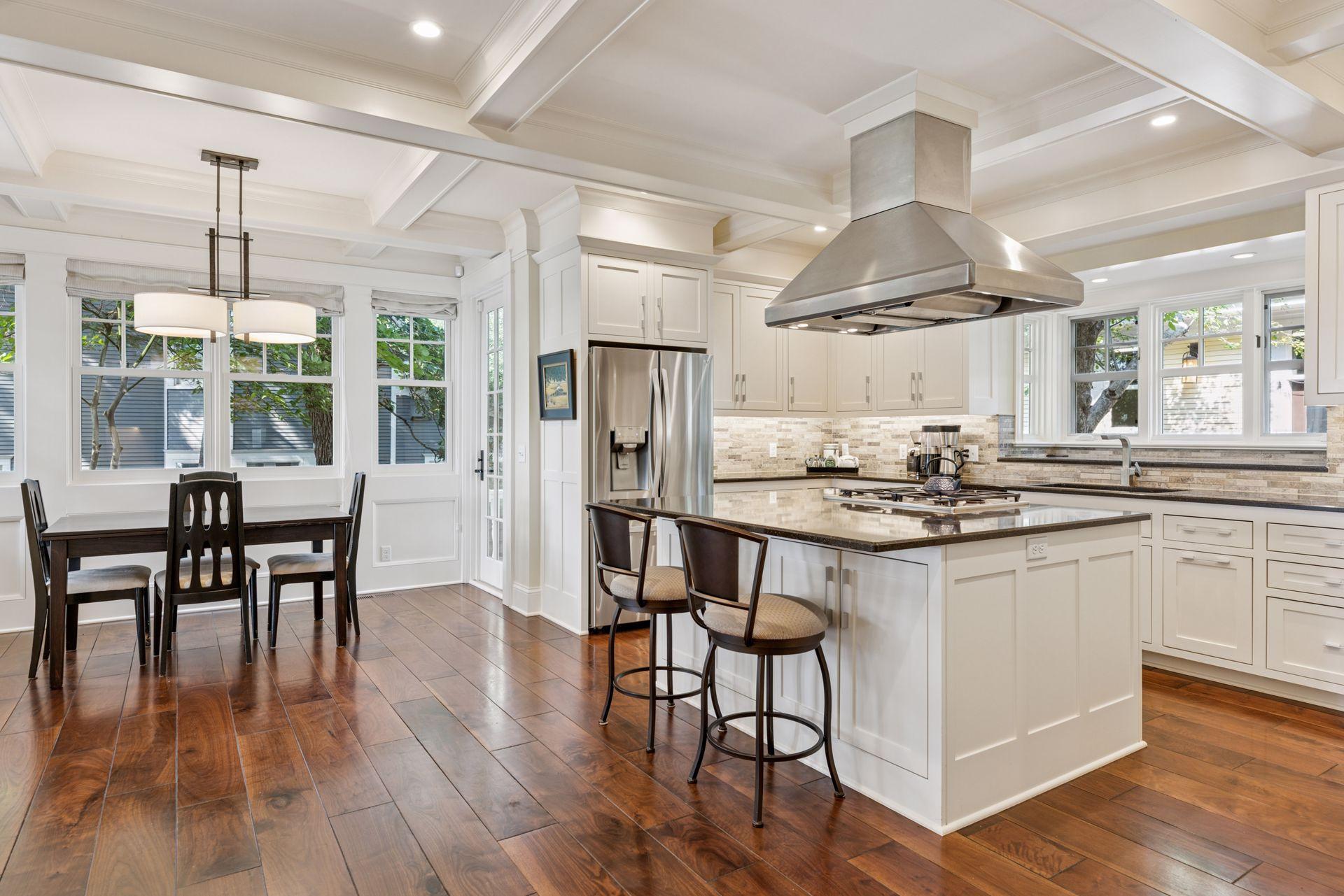 33x24 Fully Renovated Main Level Kitchen with new east, west and north-facing Marvin Ultimate wood windows, 8-inch solid walnut floors, custom enameled Danners cabinetry, coffered ceilings and mill work, Granite countertops and stainless appliances.
