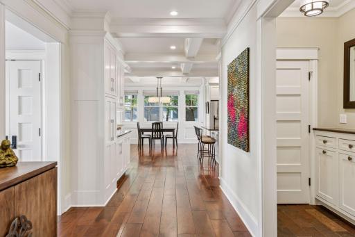 Mid hallway through the main floor showing extra storage and natuarl light throughout the main floor.