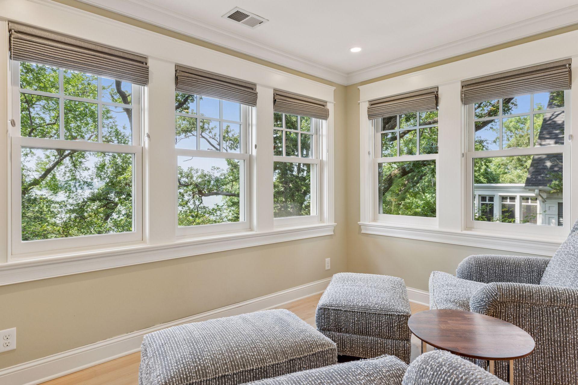 12x11 Fully renovated Primary bedroom-attached sitting room with Marvin Ultimate wood windows, custom enameled millwork and solid walnut floors West and north facing windows.