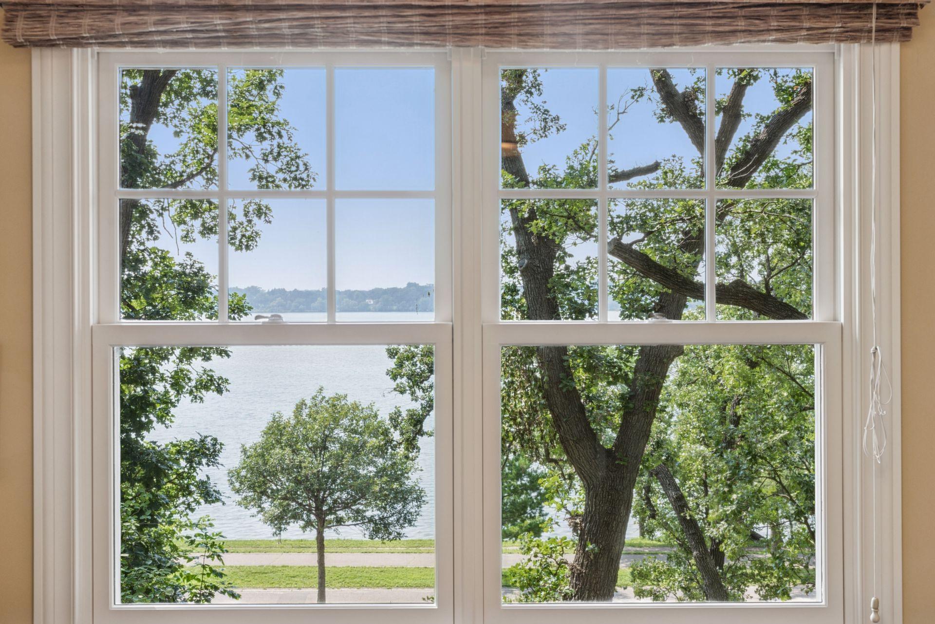 13x12 2nd floor fully renovated Bedroom #3 with 8 inch walnut floors, enameled millwork, south and west-facing windows.