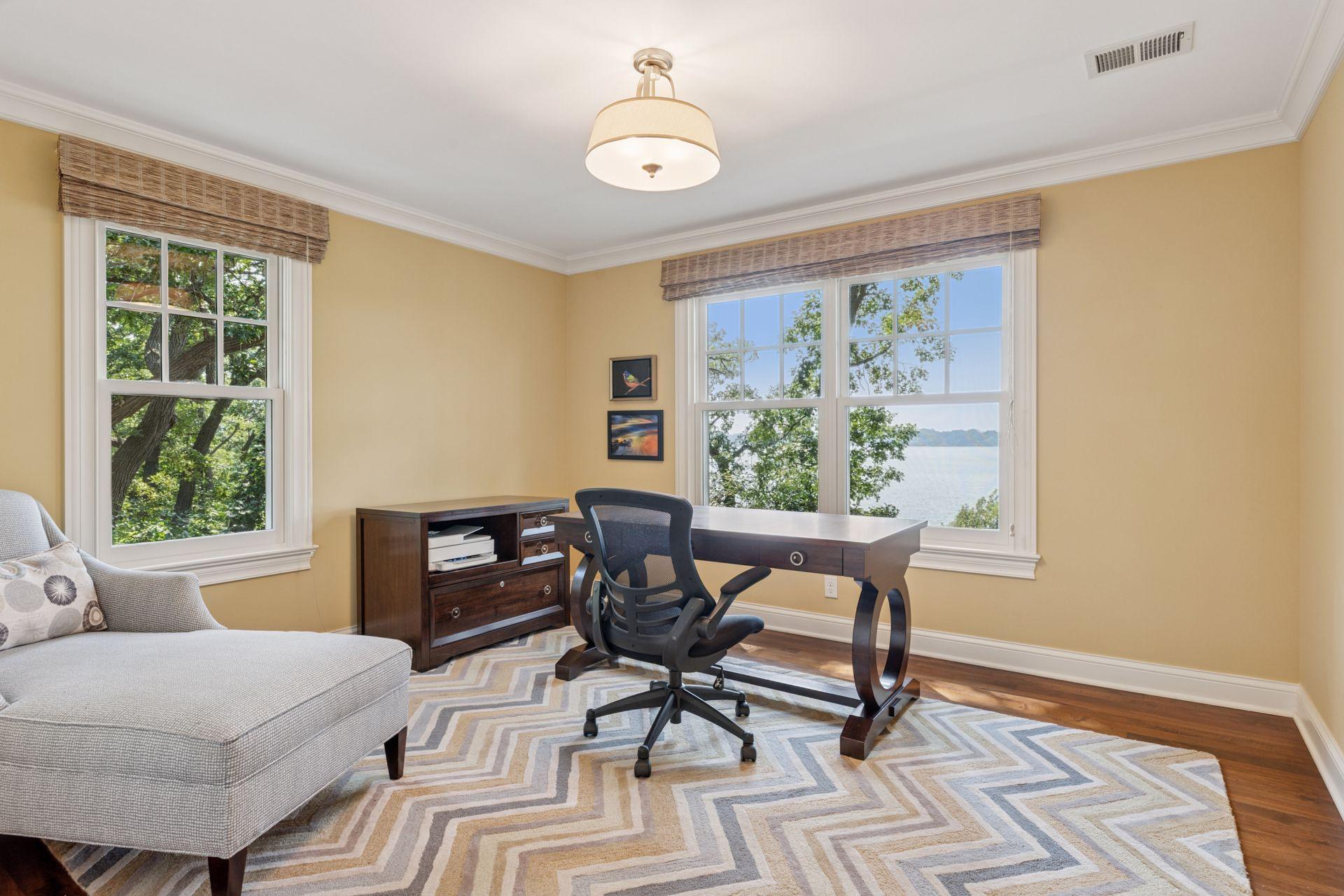 13x12 2nd floor fully renovated Bedroom #3 with 8 inch walnut floors, enameled millwork, south and west-facing windows.