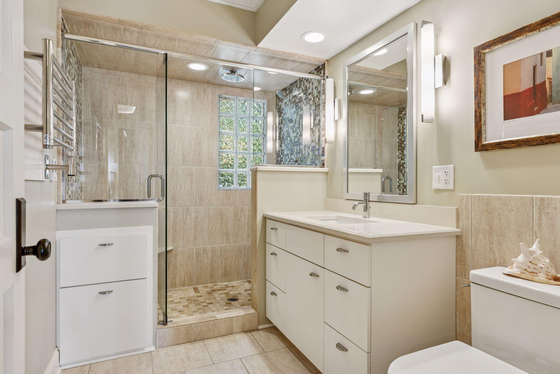 2nd floor fully renovated 3/4 bathroom with heated towel racks and fully tiled walk-in shower.