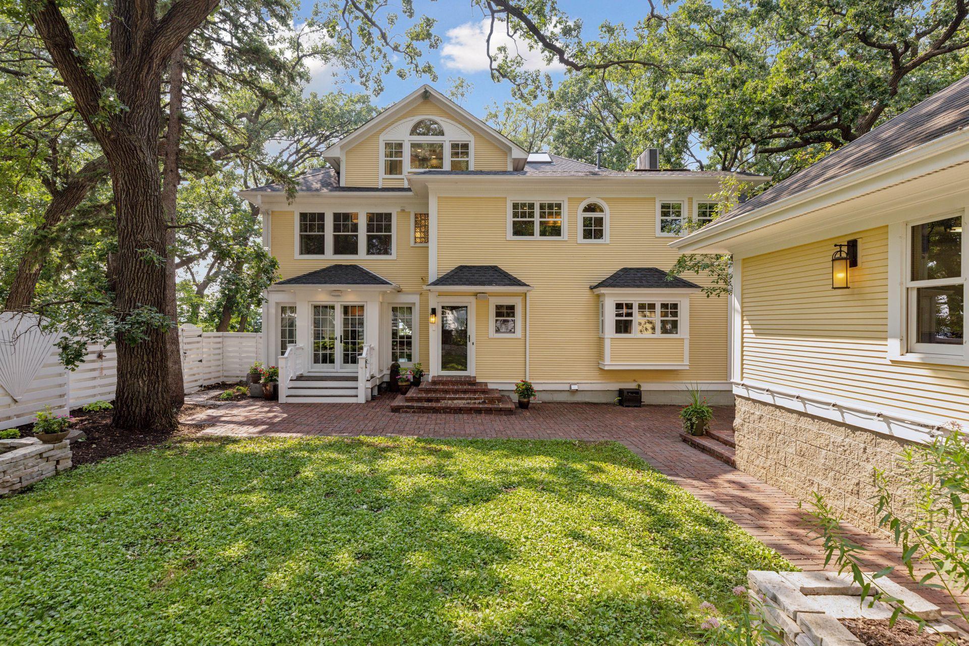 Fully fenced in back yard with reclaimed paver patio, professional landscaping, irrigation system, and water feature creates an amazing private oasis in the city for relaxing or entertaining.
