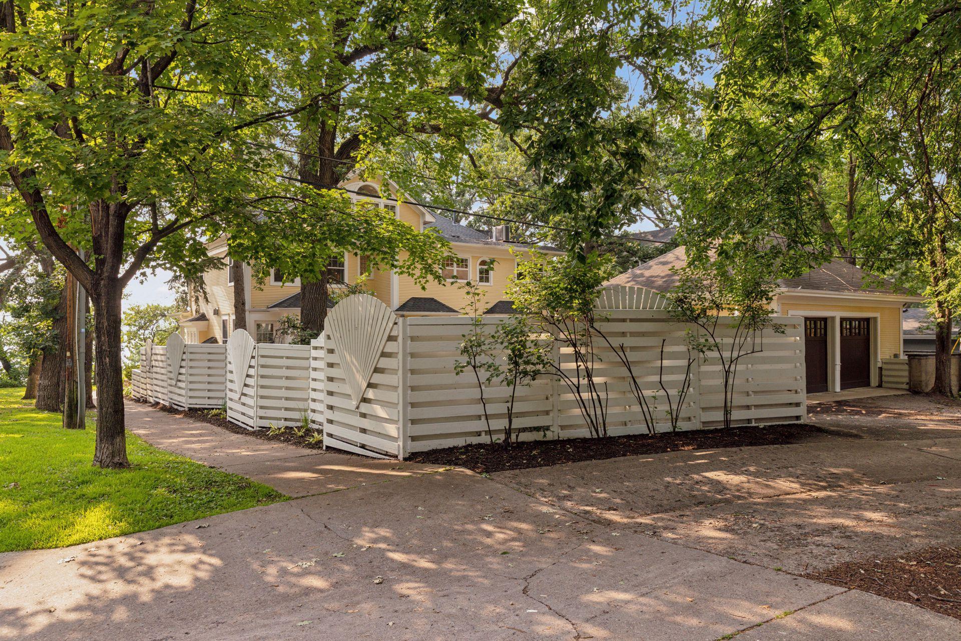 Fully fenced in back yard with reclaimed paver patio, professional landscaping, irrigation system, and water feature creates an amazing private oasis in the city for relaxing or entertaining.