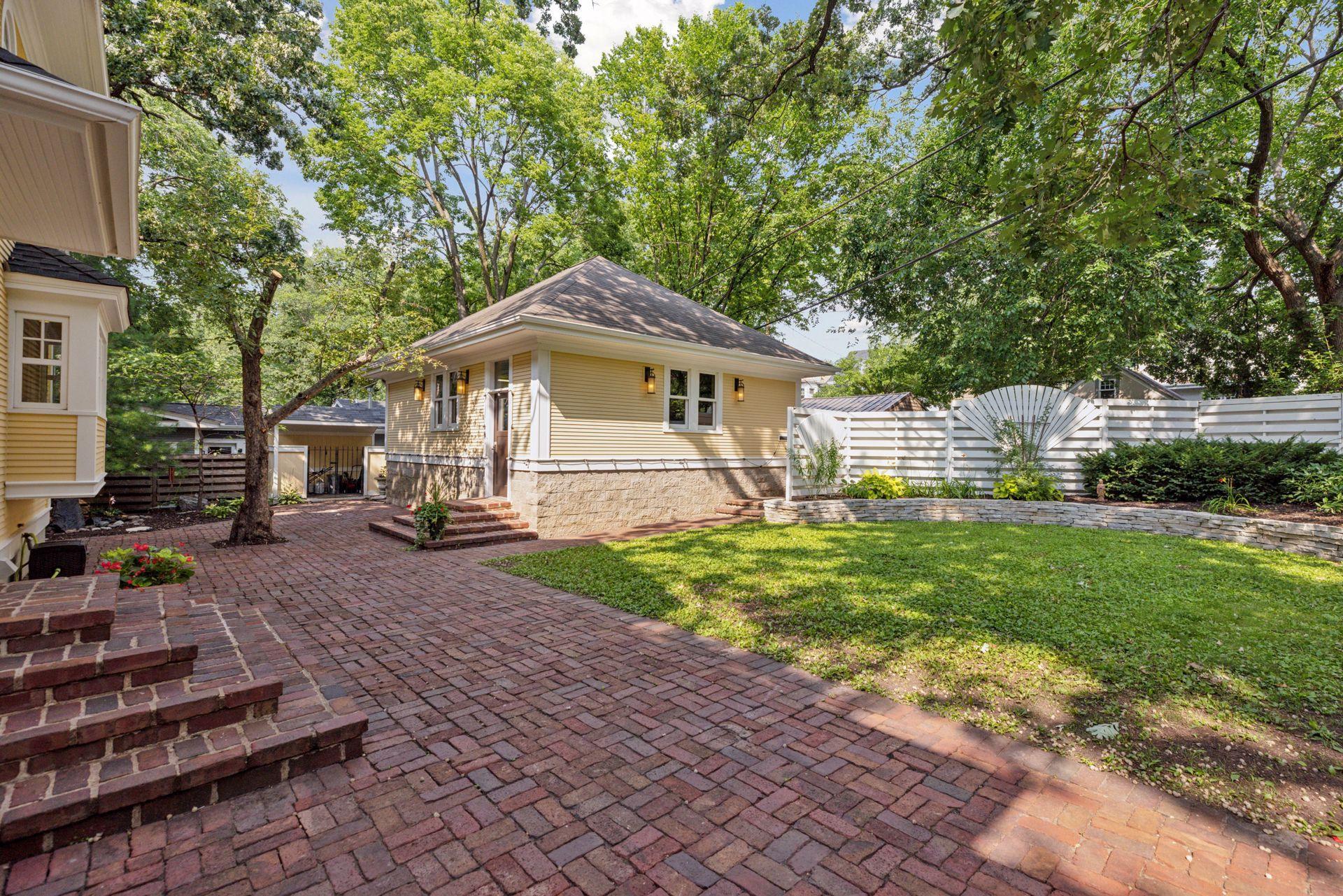 Fully fenced in back yard with reclaimed paver patio, professional landscaping, irrigation system, and water feature creates an amazing private oasis in the city for relaxing or entertaining.
