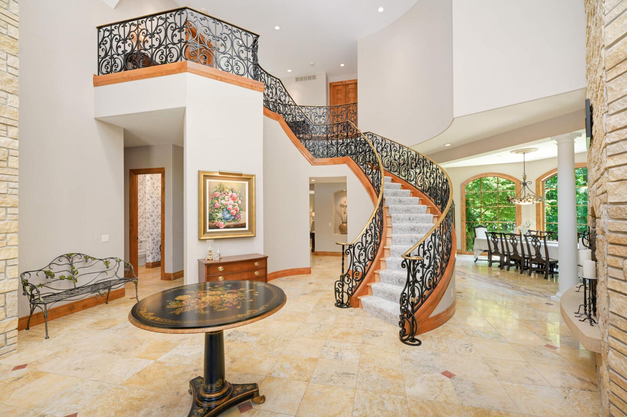 Stunning spiral staircase to upper level