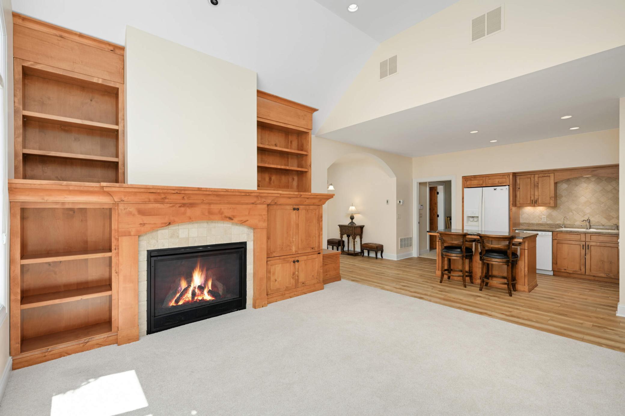 Cozy fireplace with built in storage shelves