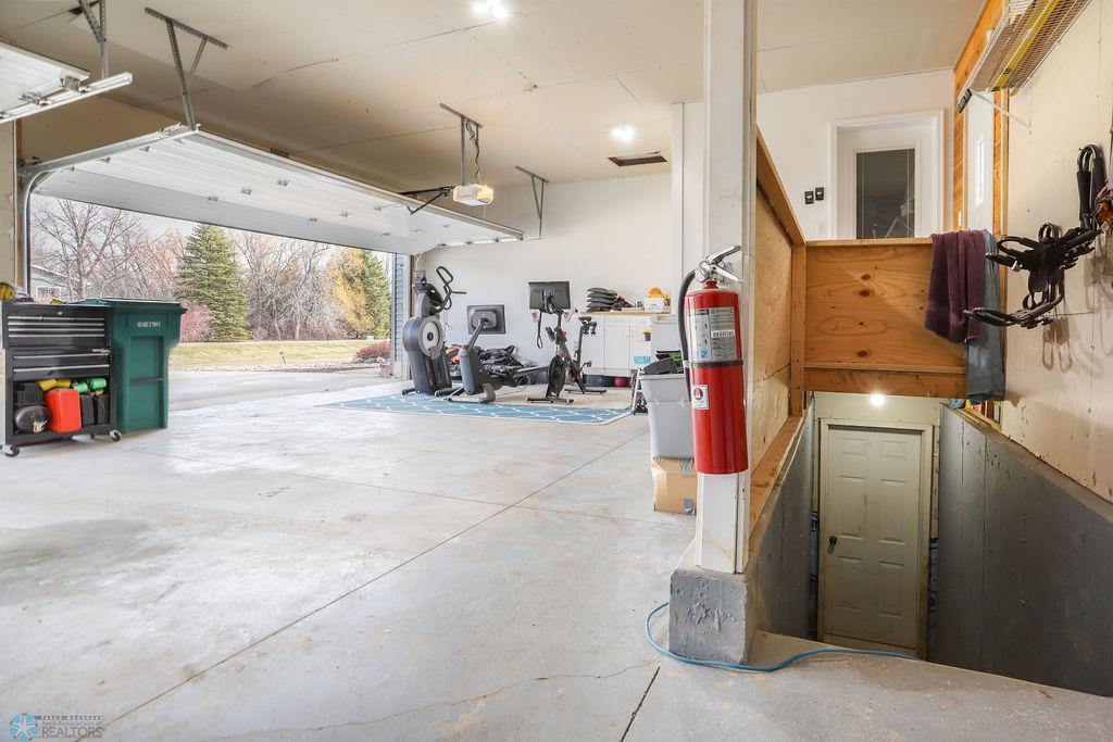 Garage interior with access to basement
