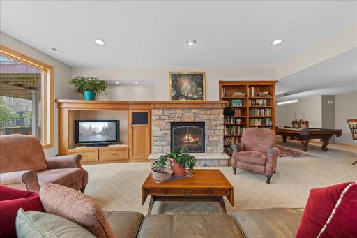 Lower level family room with gas fireplace and custom cabinetry.