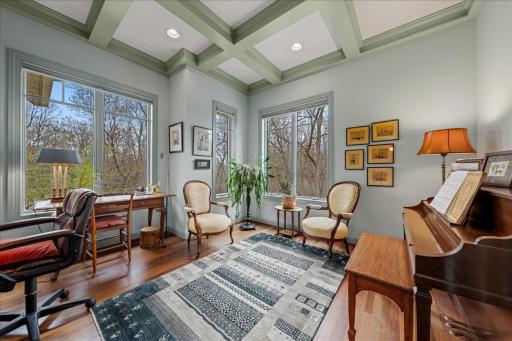 Den/Office in front part of home with tray ceiling.
