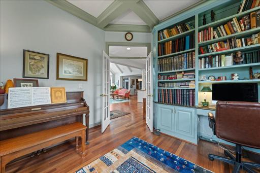 Floor to ceiling book shelf with desk area.