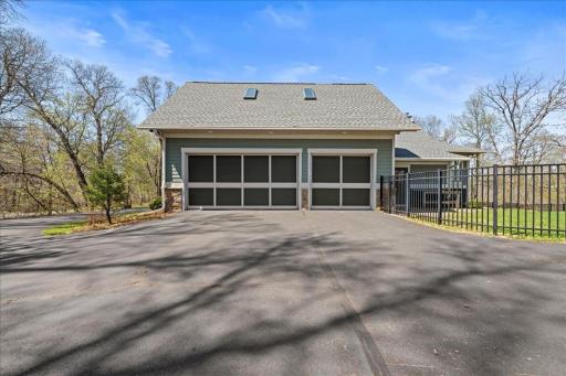 3 car garage with service door leading to backyard.