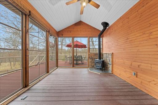 Access screen porch from informal dining/hearth room. Equipped with ceiling fan, fireplace, outlet, and windows you can higher or lower to your weather needs.