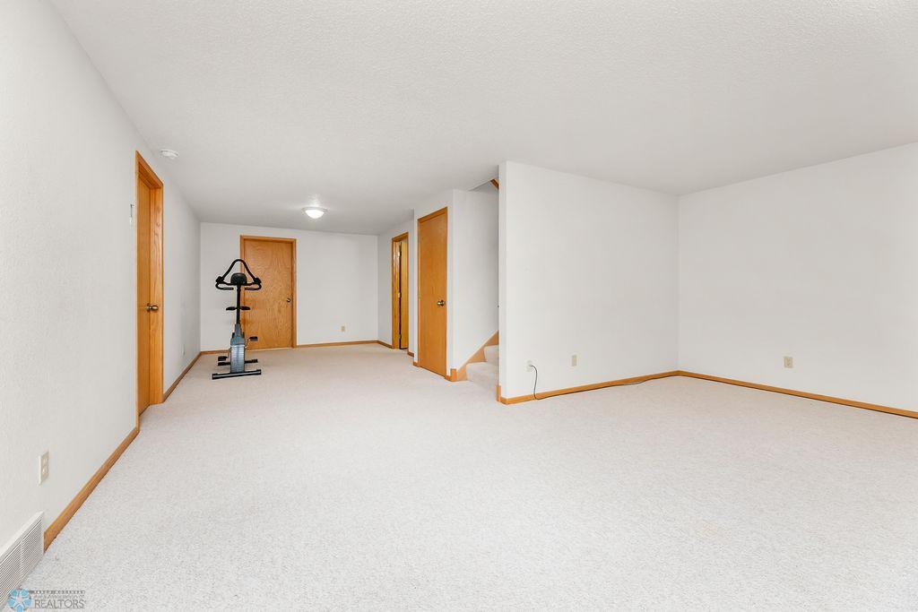 Basement offers family room, 2 beds, 1 bath, laundry & storage.