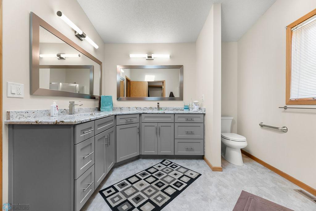 Huge 3/4 Primary Bathroom offers double sinks & lots of storage
