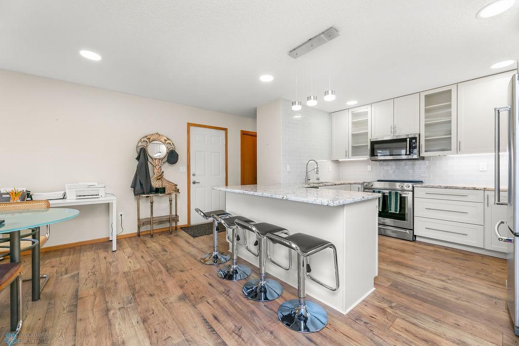 Kitchen view to garage entry & mudroom/storage closets