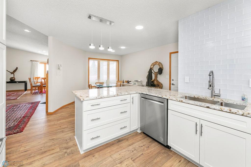 Shaker-style cabinets. Base drawers. Undermount sink. Modern faucet.