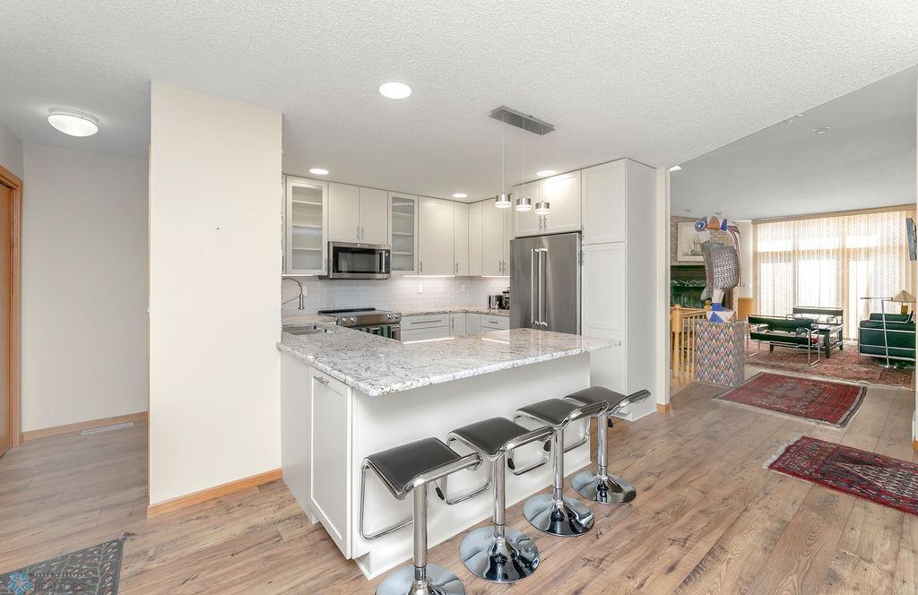 Breakfast bar peninsula offers more storage & seating for 3-4