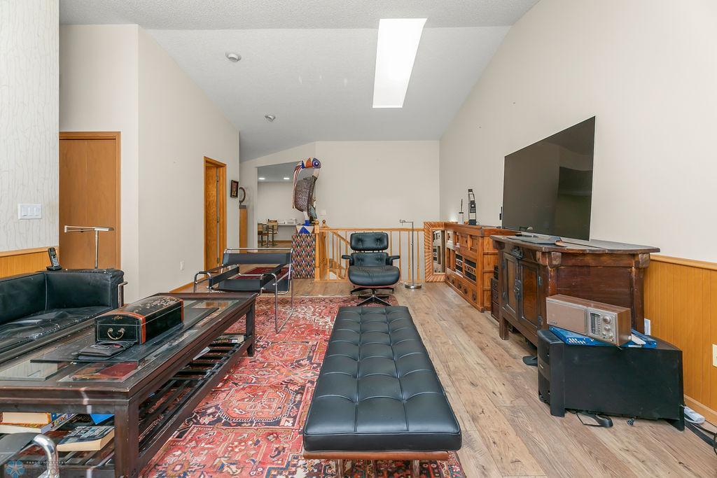 Vaulted ceiling, Skylight, Engineered wood floors.