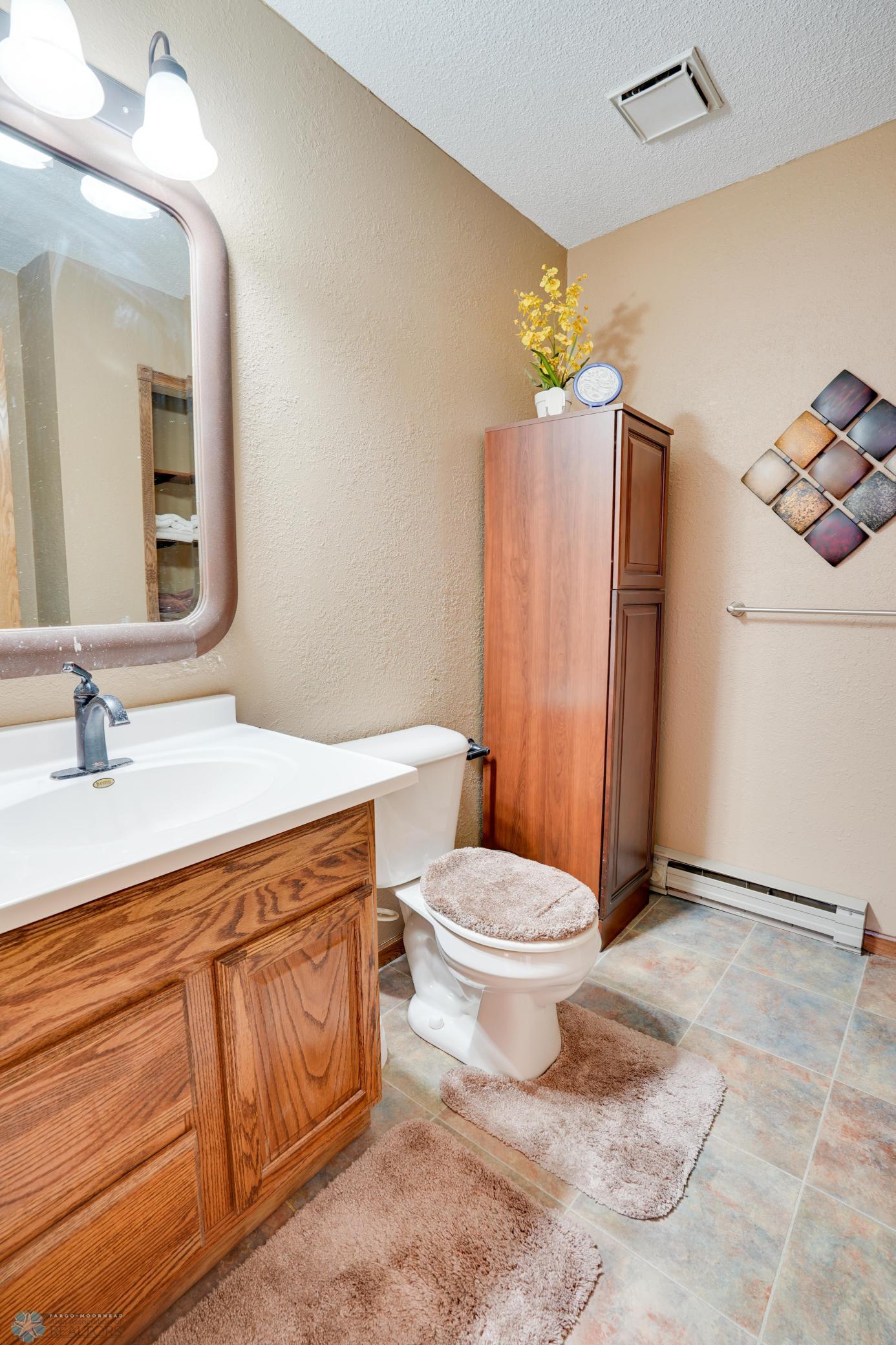 Offers linen storage, storage nook, walk-in shower.