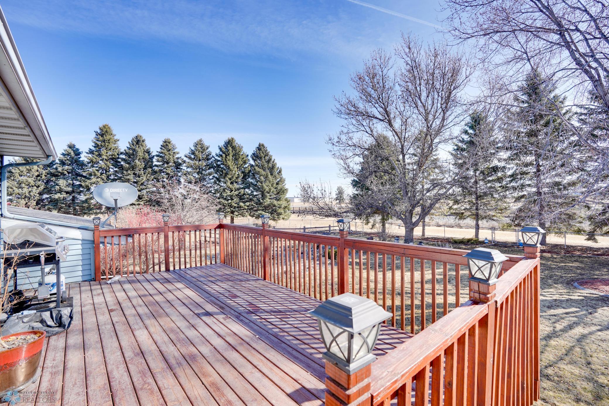 Spacious wood deck overlooks your huge backyard