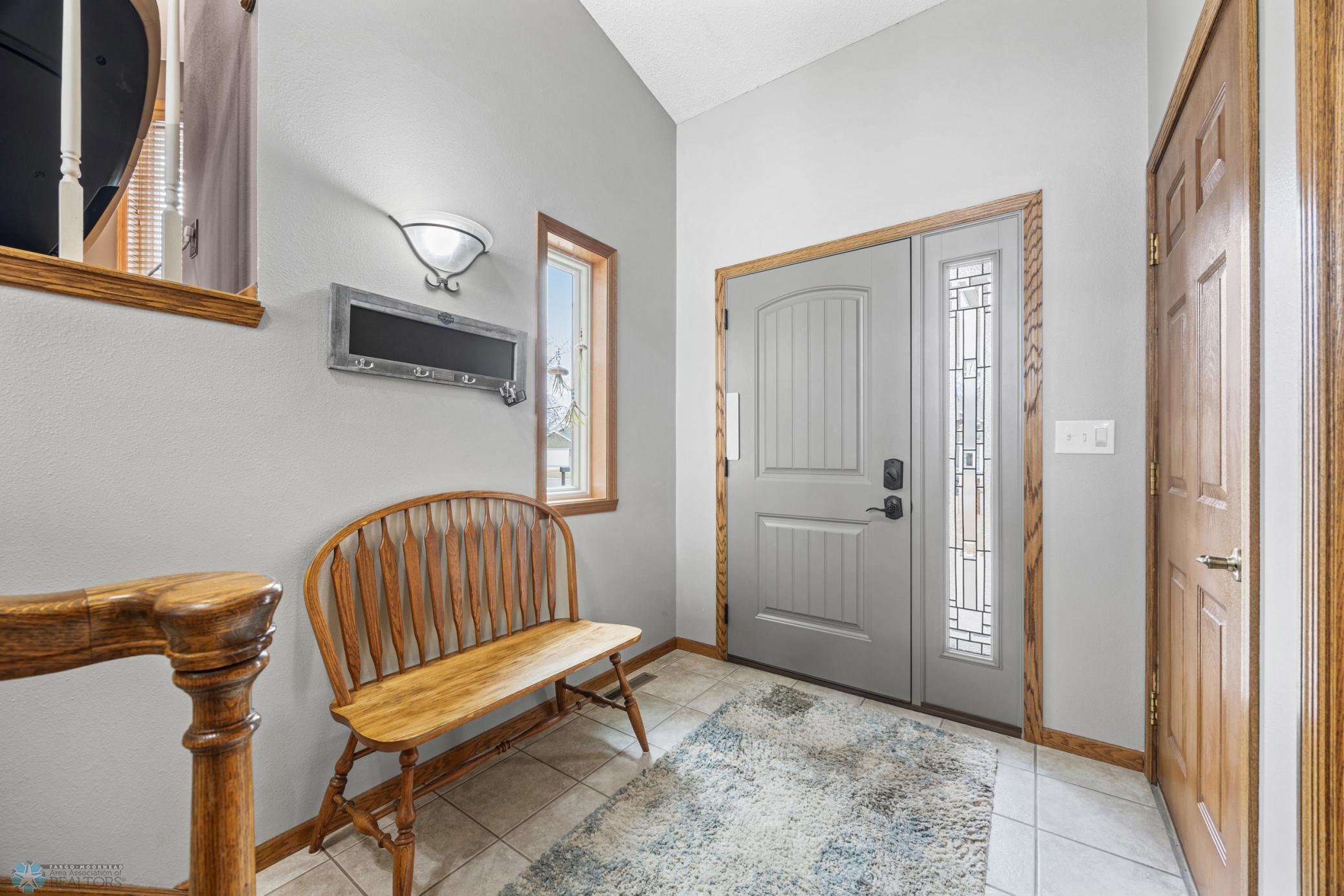 Welcoming Foyer with tile floor & coat closet