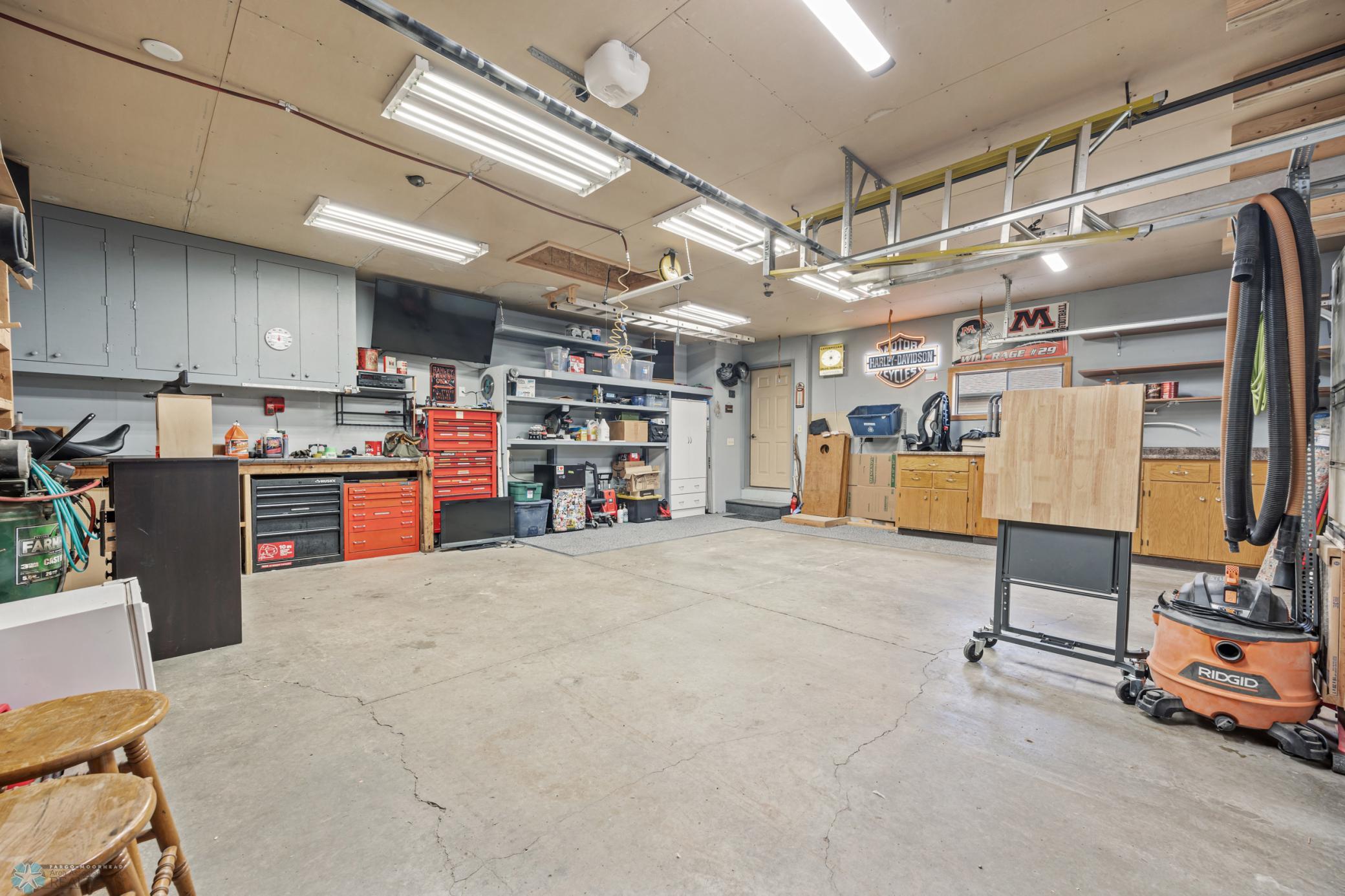 Garage - with extra overhead lighting (Gray upper cabinets & white wardrobe cabinet EXcluded)